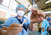 Bacolod launches 5th ‘Vax-i’ A healthcare worker shows a vial of China-made CoronaVac vaccine against coronavirus disease 2019. The Commission on Human Rights in Region 6 is asking the government to include persons deprived of liberty in its vaccination program.