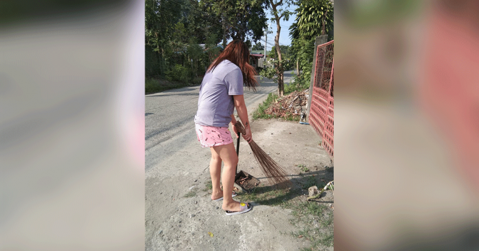 woman-cleaning A woman cleans the area in front of her house in Barangay PHHC Block 22, Mandurriao, Iloilo City. Staying home amid the coronavirus pandemic gives people more time to “search and destroy” possible breeding areas of mosquitos, according to the Department of Health. PHOTO BY PAUL ALDRIN MATUNDING
