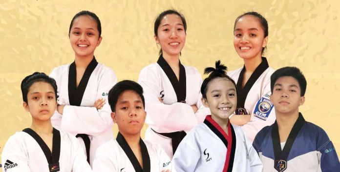 Sports-2 Taekwondo jins from A. Diasnes Gym (first row from left) Elisha Aguilar, Elaine Margaret Borres, and Elizabeth Marie Borres, (second row from left) Seth Ryan Templanza, Antonio Miguel Nafarrete, Kian Ezekiel Castigador, and Janus Miguel Tacsagon harvest medals in the recently held 2021 Online West Coast International Taekwondo Championships. A. DIASNES TAEKWONDO GYM