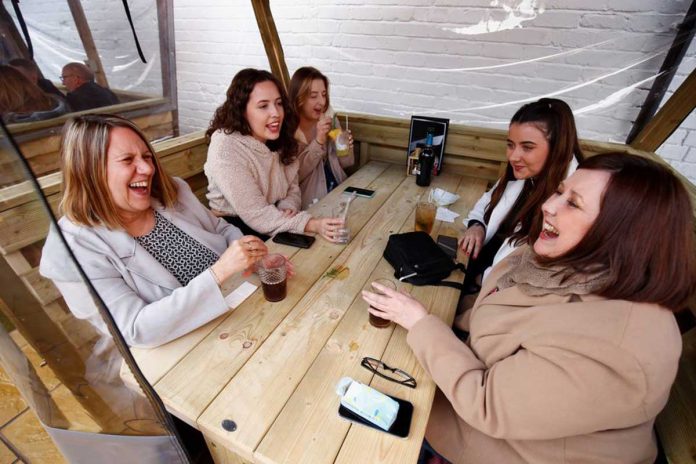World-2 Customers at a pub enjoy drinks, as lockdown eases amid the coronavirus disease 2019 pandemic, in Northwich, Cheshire, Britain. REUTERS/JASON CAIRNDUFF