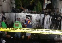 Firefighters secure the area where a blaze broke out in Barangay Calaparan, Arevalo, Iloilo City on Saturday, May 22, 2022. A house was totally gutted while one was damaged. JAP FAJARDO/PN
