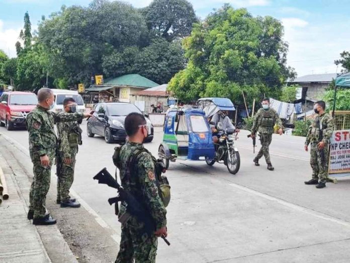 checkpoint CHECKPOINT. Police officers man a checkpoint at the entrance of Barangay Bito-on, Jaro, Iloilo City. Starting today, only essential travelers are allowed to enter the city as part of the city government’s preemptive measures against coronavirus disease 2019. ICPO