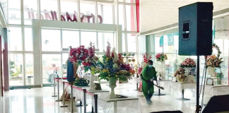 A personnel of the City Disaster Risk Reduction and Management Office disinfects CityMall in Passi City, Iloilo. JENIK FERNANDEZ/CDRRMO