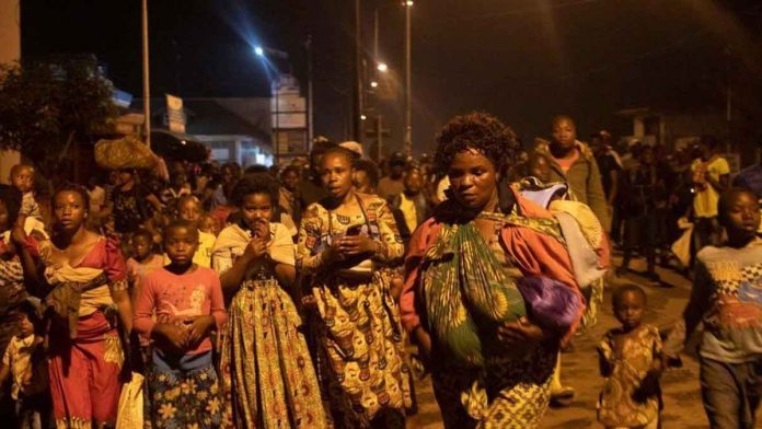 congo Residents carry mattresses and other belongings as they flee to safety. GETTY IMAGES