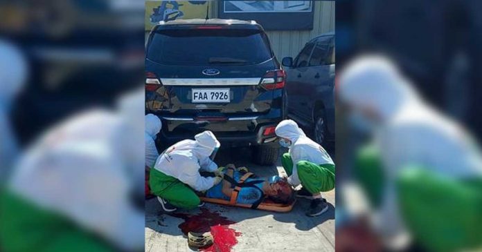 heredia Responders check the body of the slain municipal administrator of Pilar, Capiz, John Heredia, in Roxas City. He was shot multiple times by motorcycle-riding gunmen.