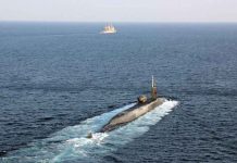 US Navy vessels are escorting USS Georgia, a guided-missile submarine, as it transits the Strait of Hormuz. US NAVY PHOTO