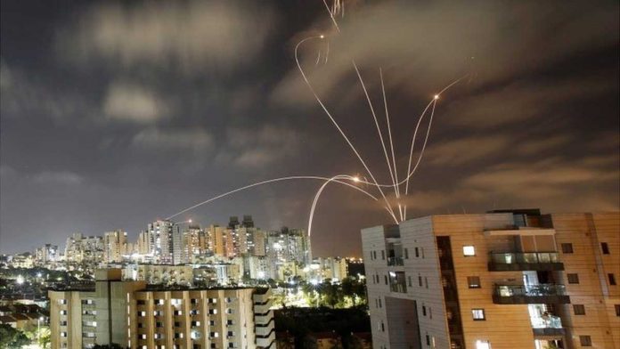 israel Israel’s Iron Dome anti-missile system – seen here over Ashkelon – aims to protect towns and cities from rockets. REUTERS