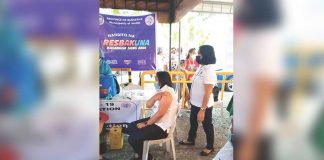 A frontliner in Jordan, GuimAras receives her initial dose of the vaccine against coronavirus disease. PHOTO FROM THE FACEBOOK PAGE OF MAYOR RUBEN CORPUZ