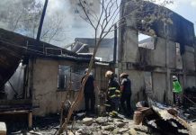 Fire hits Mandurriao homes Fire investigators check the area where a blaze broke out past noon yesterday, May 24. JAP FAJARDO/PN