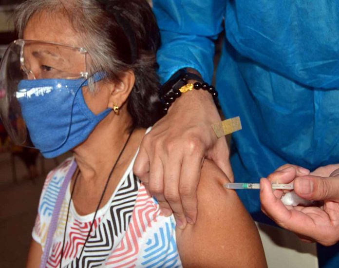 middle-east VACCINATION COMPLETE. An elderly woman gets her second dose of the Sinovac COVID-19 vaccine at the Pasay City West High School. More Filipinos are expected to be vaccinated with the arrival of more COVID-19 vaccine supplies in the coming months. PNA