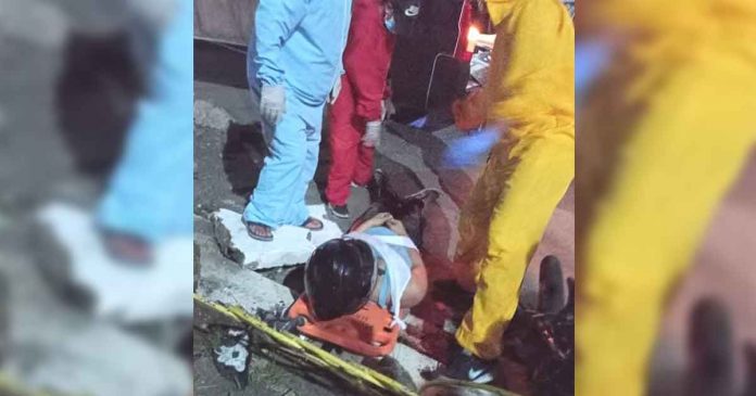 motorcycle-rider Rescuers prepare to carry this motorist on a stretcher following an accident in Barangay Villavert-Jimenez, Pandan, Antique on May 22, 2021. Unfortunately, the motorist died.