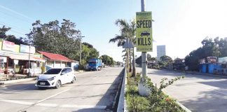 A road safety sign is prominently displayed along the national highway in Barangay Mali-ao, Pavia, Iloilo. The Sangguniang Panlalawigan is urging concerned authorities to put up more warning signs in accident-prone areas. Panay News Photo