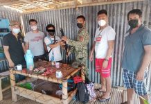 Alyas Anak (3rd from left) surrenders to authorities in Barangay Caridad, Culasi, Antique on May 24, 2021. PHOTO FROM CULASI MPS
