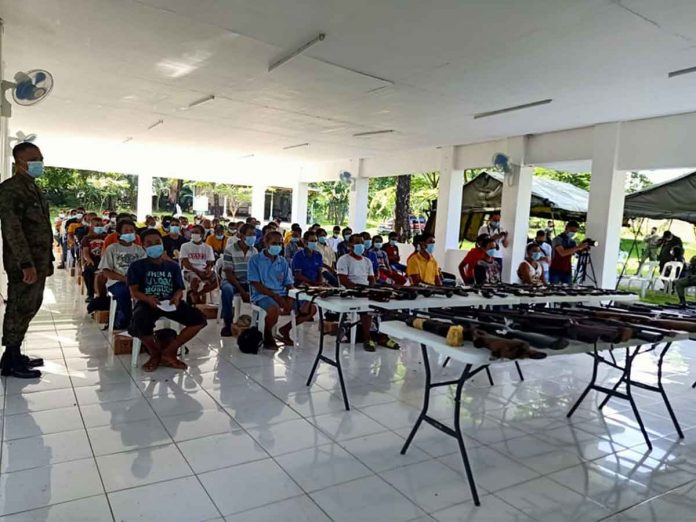 rebels-surrender Seventy members and supporters of the rebel group Militia ng Bayan (People’s Militia) surrendered to the Philippine Army’s 61st Infantry Battalion in Miag-ao, Iloilo on May 24. RUBY SILUBRICO/PN