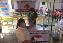 A frontliner gets her vital signs checked prior to vaccination against coronavirus in this vaccination center of Jorda, Guimaras. PHOTO FROM THE FACEBOOK PAGE OF MAYOR RUBEN CORPUZ