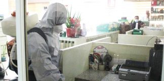 This photo from the Facebook page of Radyo Kaabyanan 88.5 FM - Sibalom, Antique, a community radio station, shows a personnel of the Municipal Disaster Risk Reduction and Management Office disinfecting an office in the town hall of Sibalom.