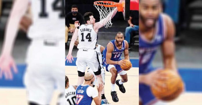 sports-banner New York Knicks' Alec Burks (18) passes away from San Antonio Spurs' Drew Eubanks (14) during the second half of an NBA basketball game in New York. PHOTO BY: AP PHOTO/FRANK FRANKLIN II, POOL