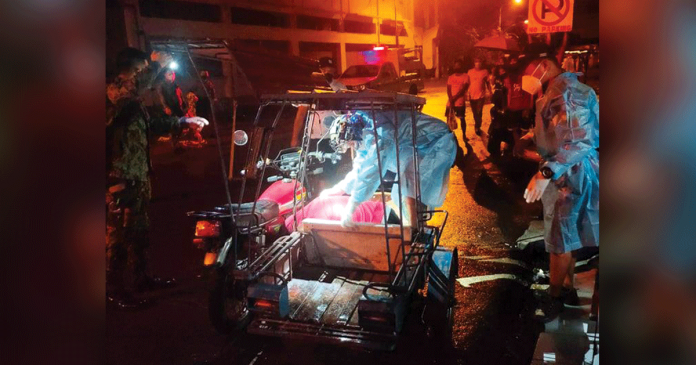 A beautician lies dead inside a tricycle in Barangay 12, Bacolod City. He was shot. POLICE STATION 1/BCPO
