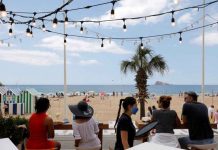 ‘Europe by no means out of danger in fight against pandemic’ People enjoy the weather on Levante beach in Benidorm, Spain. The WHO has urged Europeans to travel responsibly during the holiday season, since the continent was “by no means out of danger” in the battle against COVID-19. EVA MANEZ LOPEZ/REUTERS