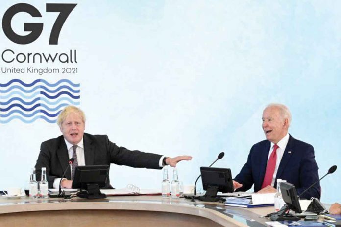 g7-rivals-china United States President Joe Biden (right) and Britain's Prime Minister Boris Johnson (left) attend a working session during G7 summit in Carbis Bay, Cornwall in Britain, June 12, 2021. LEON NEAL/POOL VIA REUTERS