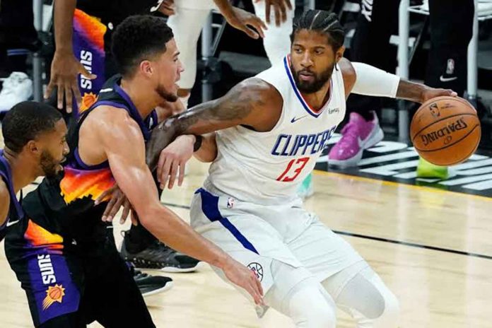 george Los Angeles Clippers guard Paul George (right) is being defended by Phoenix Suns guard Devin Booker (left) during the first half of Game 5 of their Western Conference finals. AP PHOTO/MATT YORK