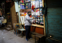 India re-opens major cities as COVID cases dropped A shopkeeper cleans his store at a market area in New Delhi, India after authorities eased lockdown restrictions imposed to slow down the spread of COVID-19. REUTERS/ADNAN ABIDI