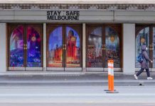 Melbourne extends COVID lockdown for 2nd week A woman walks past a "Stay Safe Melbourne" sign on a mostly-empty city street on the first day of a seven-day lockdown as the state of Victoria in Australia looks to curb the spread of COVID-19. REUTERS/SANDRA SANDERS