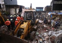 Building collapse kills 11 after monsoon flooding in Mumbai Rescuers clear the debris to find any residents possibly still trapped after a three-story dilapidated building collapsed following heavy monsoon rains in Mumbai, India on Thursday. AP PHOTO/RAFIQ MAQBOOL