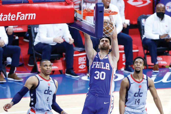 nba Philadelphia 76ers' Fukuan Korkmaz dunks against the Washington Wizards during Game 5 of their NBA Eastern Conference first-round playoffs series on Wednesday. GETTY IMAGES