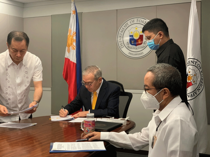news-DFA Foreign Affairs Secretary Teodoro Locsin, Jr. signs the Memorandum of Understanding on Cooperation in the Deployment of Private Staff. DFA-OPCD PHOTO