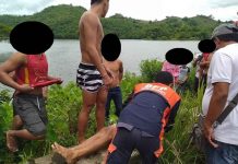 Rescuers and volunteers retrieve the body of Jonathan Galo from Marugo Lake in Barangay San Antonio, Tapaz, Capiz.