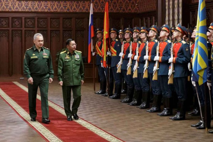 russia-myanmar Russia's Defense Minister Sergei Shoigu (left) and Myanmar's Commander in-Chief Senior General Min Aung Hlaing (right) walk past the honor guard prior to their talks in Moscow, Russia, June 22, 2021. VADIM SAVITSKIY/MINISTRY OF DEFENSE OF THE RUSSIAN FEDERATION VIA REUTERS