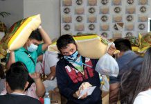 Displaced employees of the fire-hit Gaisano Grand Mall in San Jose, Antique receive cash aid, sacks of rice and other goods from the provincial government. JERON NIETES/PIO