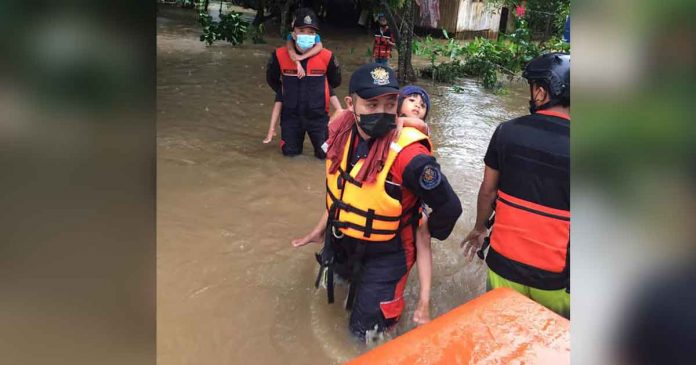 ts-dante Responders rescue children from rising floodwaters in President Roxas, Capiz on Wednesday morning. OPFM CAPIZ BFP