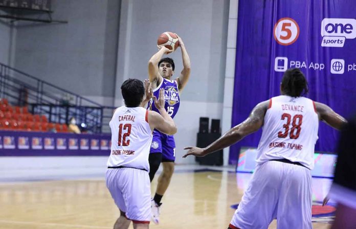 PBA-Images6 Kiefer Ravena of NLEX Road Warriors attempts for a basket while Barangay Ginebra San Miguel Kings’ Prince Caperal (12) defends during their PBA Philippine Cup match on Sunday at the Ynares Sports Arena in Pasig City. PBA MEDIA BUREAU