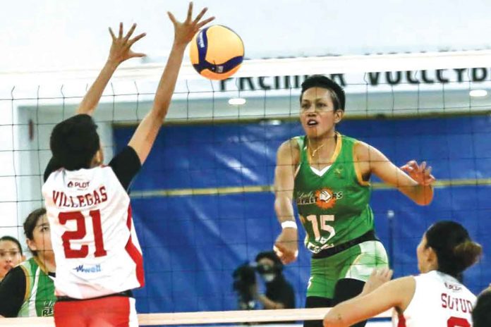 Aklanon Dell Palomata of Sta. Lucia Lady Realtors (15) smashes the ball towards the defense of Negrense Kath Villegas of PLDT Home Fibr Power Hitters (21) during their 2021 PVL Open Conference game on Monday night. PVL MEDIA BUREAU Aklanon Dell Palomata of Sta. Lucia Lady Realtors (15) smashes the ball towards the defense of Negrense Kath Villegas of PLDT Home Fibr Power Hitters (21) during their 2021 PVL Open Conference game on Monday night. PVL MEDIA BUREAU