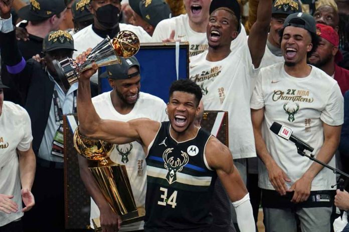 Milwaukee Bucks’ Giannis Antetokounmpo (34) holds the NBA Finals’ MVP trophy after the Bucks ousted the Phoenix Suns in Game 6 of the Finals. Antetokounmpo’s 50 points powered the Bucks to prevail over the Phoenix Suns, 105-98. AP/ PAUL SANCYA