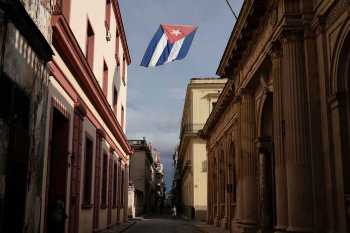 W-1 A Cuban flag flies over a street amid concerns about the spread of the coronavirus disease 2019 in downtown Havana, Cuba. REUTERS/ALEXANDRE MENEGHINI