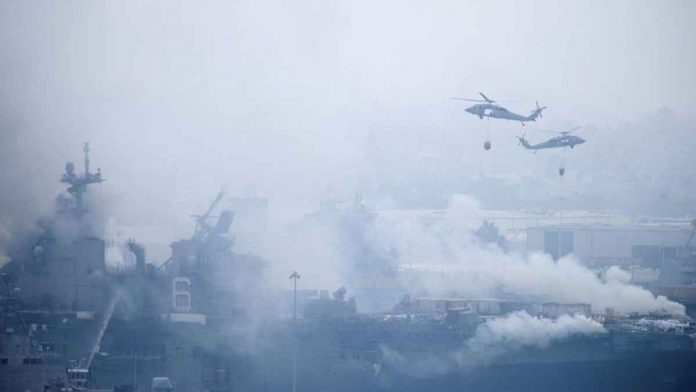 W-2 US Navy helicopters carry more than 1,500 water bucket drops to contain the raging fire in the USS Bonhomme Richard in 2020. REUTERS