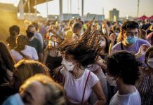 Wearing facemasks, people dance during the Cruilla music festival in Barcelona, Spain. On Wednesday, the country’s top court ruled that the strict pandemic lockdown in 2020 violated the Spanish Constitution .AP/JOAN MATEU