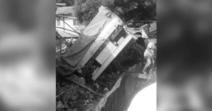 bacolod-truck-accident A cargo truck flipped along the national highway in Purok Matawhay, Barangay Binicuil, Kabankalan City, Negros Occidental yesterday. A pastor and his child were killed while three others were injured. KABANKALAN CPS