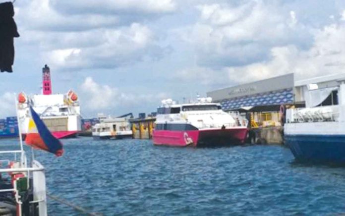 Fast crafts docked at the Bredco port in Bacolod City have stopped transporting non-essential travelers from Iloilo City on Monday. PNA Fast crafts docked at the Bredco port in Bacolod City. PNA