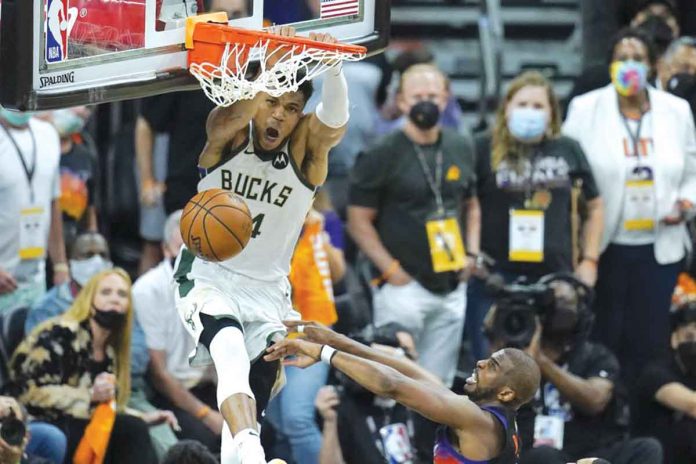 bucks Milwaukee Bucks forward Giannis Antetokounmpo dunks against the Phoenix Suns during the second half of Game 5 of their NBA Finals game. AP/ROSS D. FRANKLIN