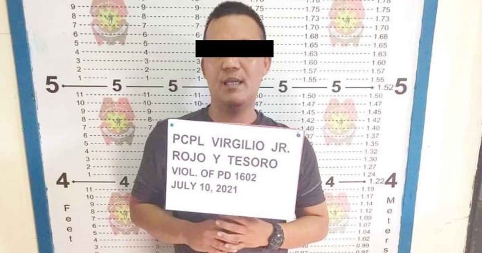 city-cop-jailed2 Mugshot of a policeman caught engaging in illegal cockfighting in Barangay Cagbang, Oton, Iloilo. OTON POLICE STATION
