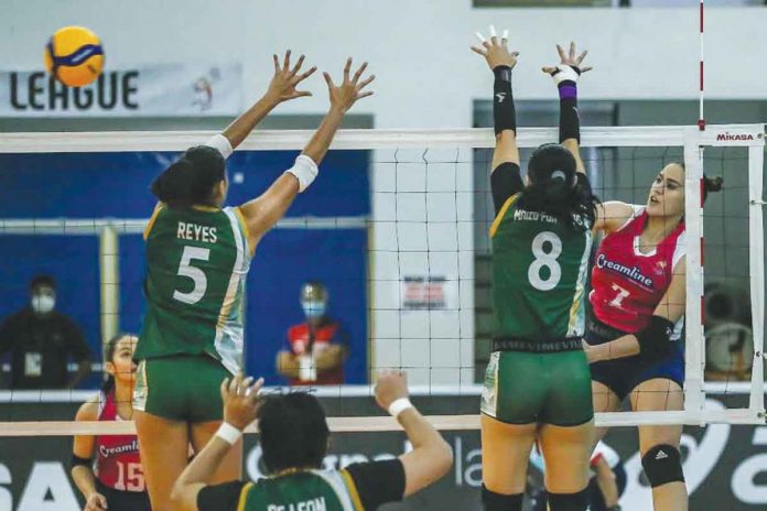 creamline Creamline Cool Smashers’ Michelle Gumabao (7) scores past the defense of Aiza Maizo-Pontillas (8) and Mika Reyes (5) of Sta. Lucia Lady Realtors. PVL MEDIA BUREAU PHOTO