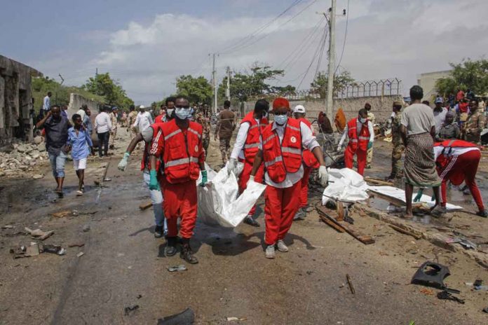 extremist-attack Medical workers carry the body of a civilian who was killed in a suicide car bomb attack that targeted the city's police commissioner in Mogadishu, Somalia. AP PHOTO/FARAH ABDI WARSAMEH