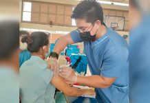 16% of city’s target population vaccinated A healthcare worker gives a resident of Iloilo City a vaccine against coronavirus disease 2019 (COVID-19) at the gym of Ateneo de Iloilo in Mandurriao district. The school is one of the vaccination sites of the city government. JAPHET FAJARDO/PN