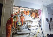 Partial hotel collapse in China kills 17 Rescue workers work at the site where a hotel building collapsed in Suzhou, Jiangsu province, China, on Monday. CHINA DAILY VIA REUTERS