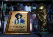 A picture of Diego Maradona and a replica of the World Cup trophy are pictured on an altar at the first Mexico's church in memory of soccer legend Diego Armando Maradona in San Andres Cholula, Puebla state in Mexico. REUTERS/EDGARD GARRIDO