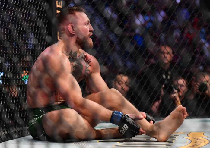 mcgregor Conor McGregor holds his leg after sustaining an injury while fighting Dustin Poirier during their UFC 264 lightweight mixed martial arts clash at the T-Mobile Arena. GARY A. VASQUEZ-USA TODAY SPORTS